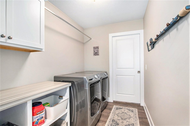 964 Everett Pkwy, South Haven, MI 49090 - laundry room with cabinet space, washer and clothes dryer, and wood finished floors