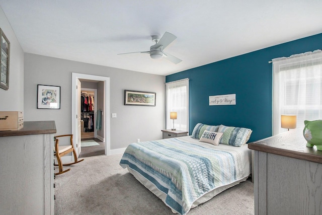 964 Everett Pkwy, South Haven, MI 49090 - bedroom with carpet, a walk in closet, ceiling fan, and a closet
