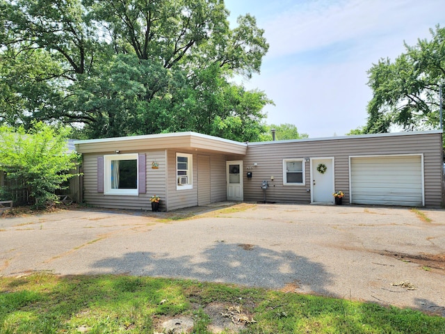 254 Holly St SW, Grand Rapids, MI 49548 - view of front of house featuring an attached garage and driveway