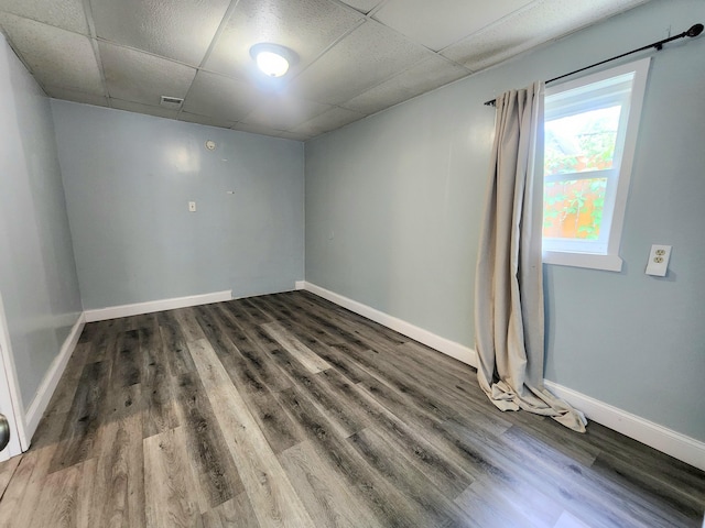 254 Holly St SW, Grand Rapids, MI 49548 - spare room with a paneled ceiling and wood finished floors