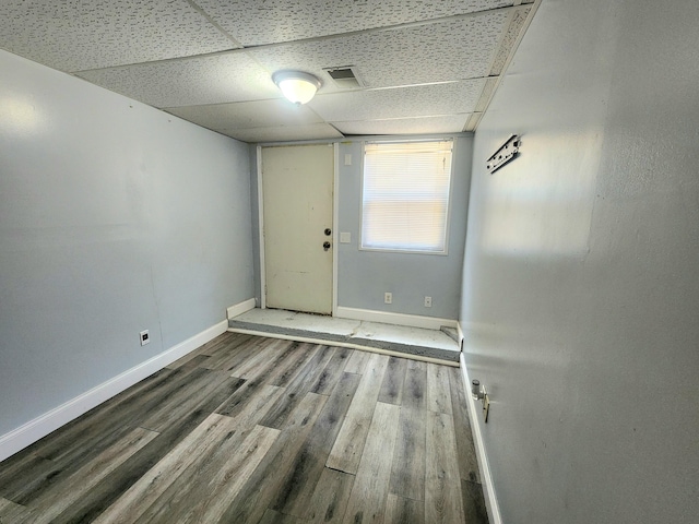 254 Holly St SW, Grand Rapids, MI 49548 - unfurnished room with a paneled ceiling and wood finished floors