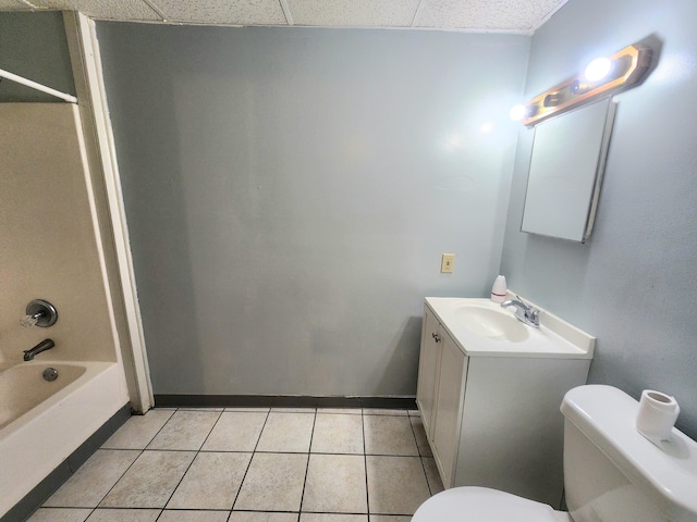 254 Holly St SW, Grand Rapids, MI 49548 - bathroom featuring vanity, tile patterned floors, bathtub / shower combination, and a paneled ceiling