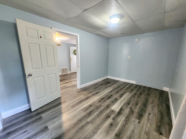 254 Holly St SW, Grand Rapids, MI 49548 - empty room with a paneled ceiling and wood finished floors