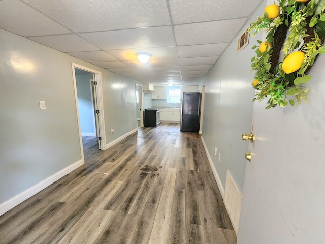 254 Holly St SW, Grand Rapids, MI 49548 - corridor featuring a paneled ceiling and wood finished floors