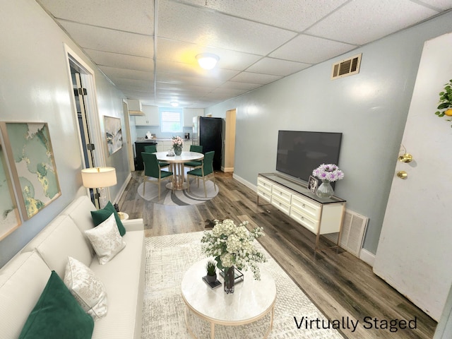 254 Holly St SW, Grand Rapids, MI 49548 - living room with a paneled ceiling and dark wood-style floors