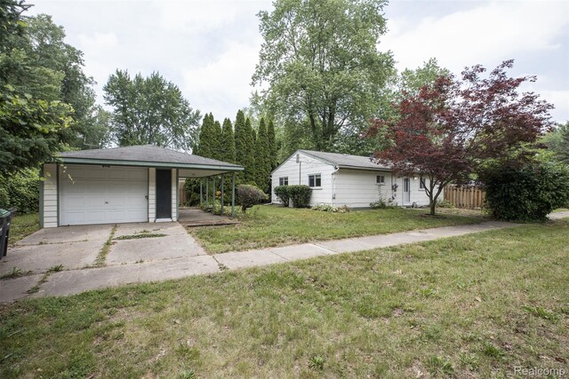 6580 Troy St, Southgate, MI 48180 - view of yard featuring concrete driveway and a garage