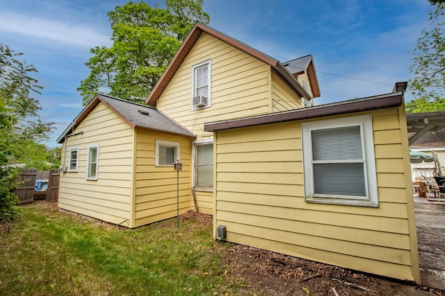 412 E Jefferson St, Hart, MI 49420 - rear view of property with an outdoor structure and cooling unit