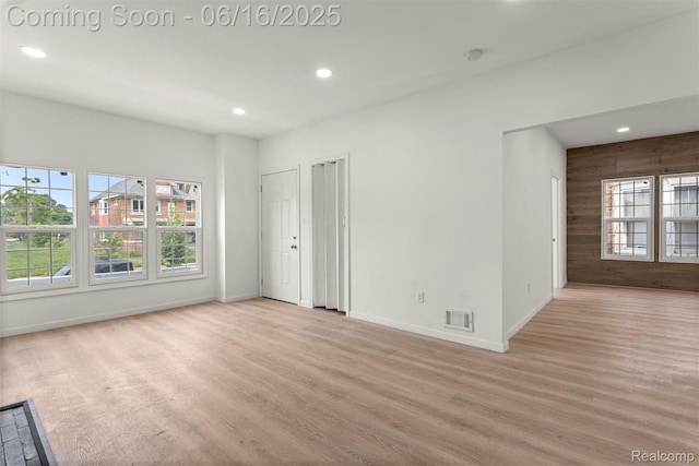 7432 Churchill St, Detroit, MI 48206 - spare room featuring light wood-style floors, recessed lighting, a smoke detector, and wooden walls