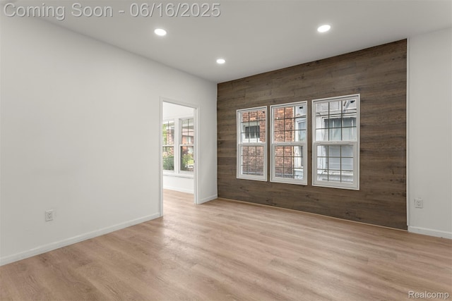 7432 Churchill St, Detroit, MI 48206 - unfurnished room with wooden walls, recessed lighting, and light wood finished floors