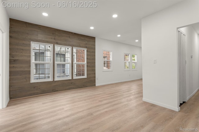 7432 Churchill St, Detroit, MI 48206 - spare room with recessed lighting, wood walls, and wood finished floors