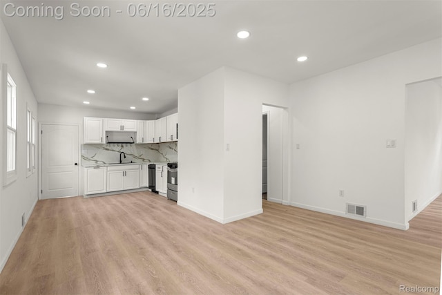 7432 Churchill St, Detroit, MI 48206 - unfurnished living room with recessed lighting and light wood-style flooring