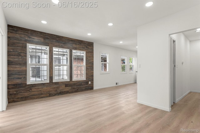 7432 Churchill St, Detroit, MI 48206 - spare room featuring recessed lighting, light wood-type flooring, and wooden walls