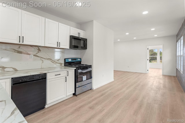 7432 Churchill St, Detroit, MI 48206 - kitchen with black appliances, light wood-type flooring, white cabinetry, recessed lighting, and light stone counters