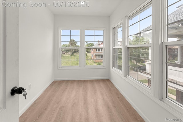 7432 Churchill St, Detroit, MI 48206 - unfurnished sunroom with wood finished floors and baseboards