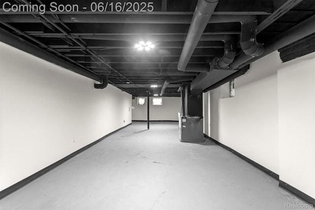 7432 Churchill St, Detroit, MI 48206 - below grade area featuring baseboards and heating unit