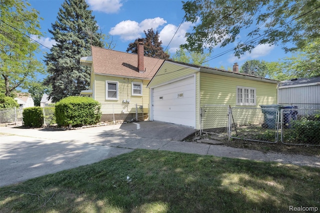 3112 Bailey Ave, Lincoln Park, MI 48146 - view of front of home featuring a chimney, driveway, a garage, and a gate