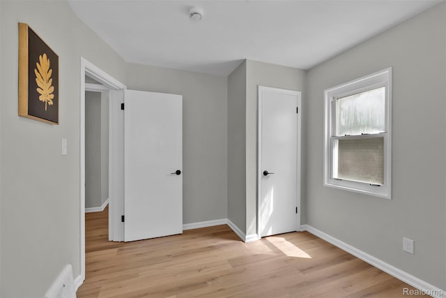 3112 Bailey Ave, Lincoln Park, MI 48146 - unfurnished bedroom with light wood-type flooring and baseboards