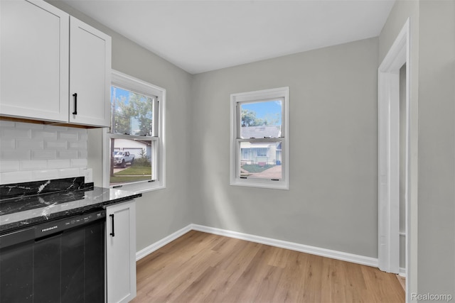 3112 Bailey Ave, Lincoln Park, MI 48146 - kitchen with dishwasher, light wood-type flooring, dark stone counters, white cabinets, and tasteful backsplash