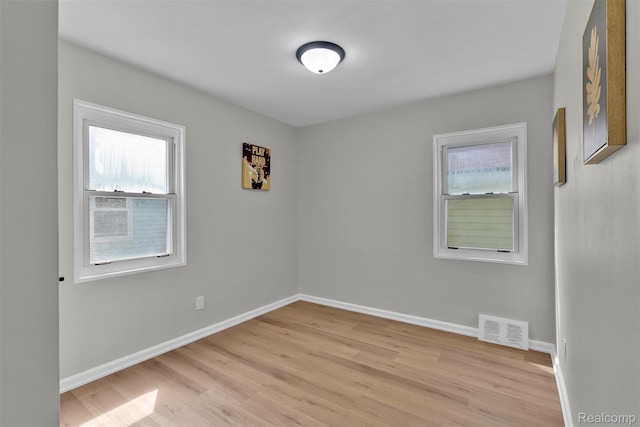 3112 Bailey Ave, Lincoln Park, MI 48146 - empty room with plenty of natural light and light wood-type flooring