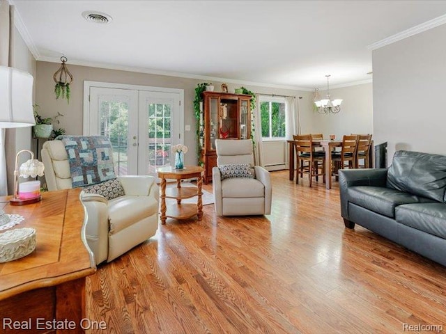 871 Vanderpool Dr, Troy, MI 48083 - living area featuring ornamental molding, a chandelier, light wood-style flooring, and french doors