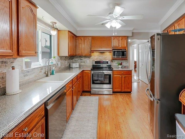 871 Vanderpool Dr, Troy, MI 48083 - kitchen with stainless steel appliances, light wood finished floors, brown cabinets, tasteful backsplash, and ornamental molding