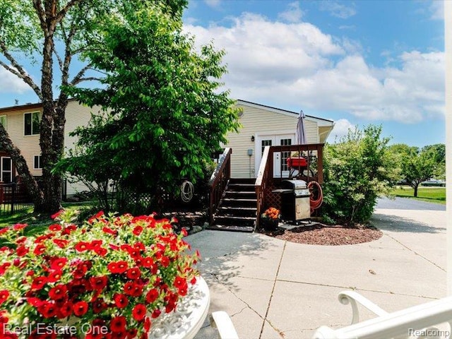 871 Vanderpool Dr, Troy, MI 48083 - view of front facade with a wooden deck