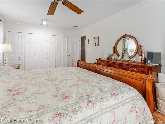 871 Vanderpool Dr, Troy, MI 48083 - bedroom featuring multiple closets, ornamental molding, and ceiling fan