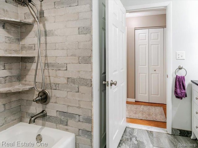 871 Vanderpool Dr, Troy, MI 48083 - bathroom featuring ornamental molding, a closet, tub / shower combination, and vanity