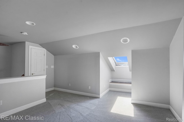 24825 Reeds Pointe Dr, Novi, MI 48374 - bonus room with a skylight, vaulted ceiling, and carpet flooring