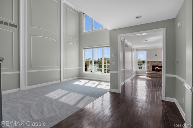 24825 Reeds Pointe Dr, Novi, MI 48374 - foyer entrance with healthy amount of natural light, a fireplace, and hardwood / wood-style flooring