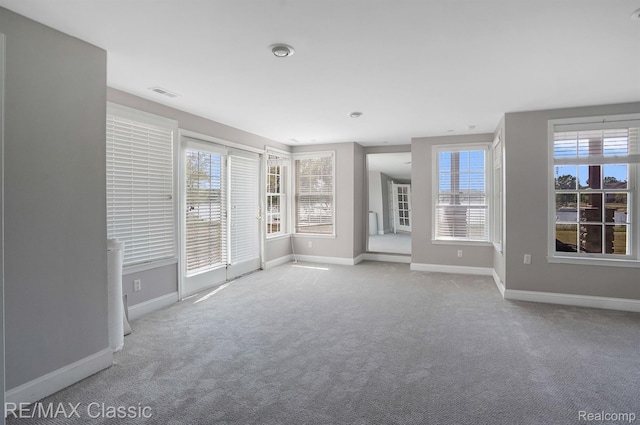 24825 Reeds Pointe Dr, Novi, MI 48374 - carpeted empty room with healthy amount of natural light