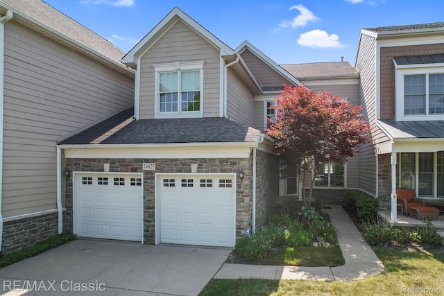 24825 Reeds Pointe Dr, Novi, MI 48374 - view of front facade with stone siding, concrete driveway, an attached garage, and a shingled roof