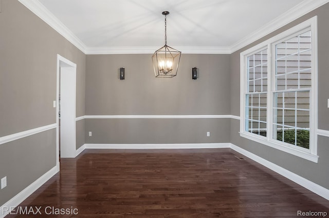 24825 Reeds Pointe Dr, Novi, MI 48374 - spare room with a chandelier, dark wood-style floors, and ornamental molding