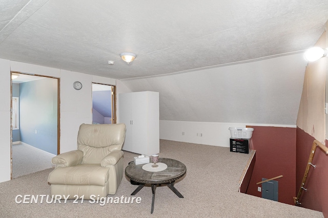 2942 Harrison St, Saginaw, MI 48604 - sitting room with carpet, vaulted ceiling, and an upstairs landing
