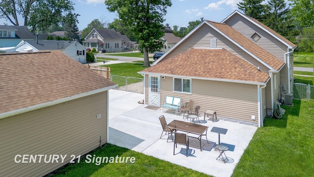 2942 Harrison St, Saginaw, MI 48604 - back of property featuring roof with shingles and a patio