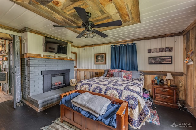 4441 Deckerville Rd, Lupton, MI 48635 - bedroom with wood walls, a fireplace, wood finished floors, and ceiling fan