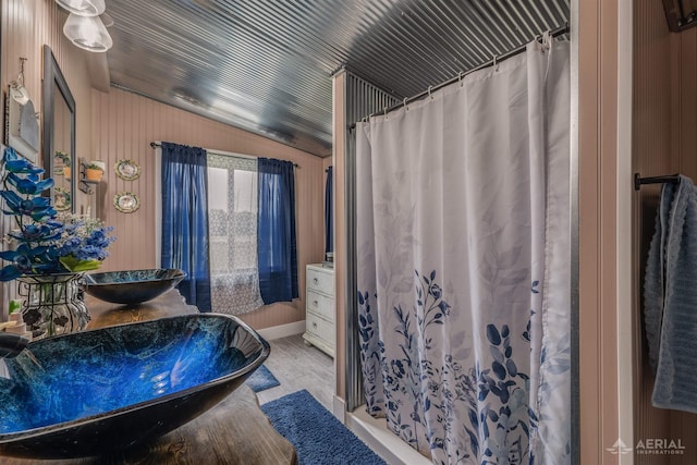 4441 Deckerville Rd, Lupton, MI 48635 - full bathroom with vanity, wood finished floors, and a shower with shower curtain