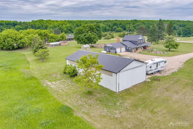 4441 Deckerville Rd, Lupton, MI 48635 - view from above of property with a heavily wooded area