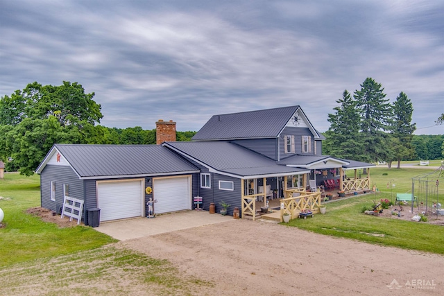 4441 Deckerville Rd, Lupton, MI 48635 - view of front of property with dirt driveway, a chimney, a front lawn, a garage, and a metal roof