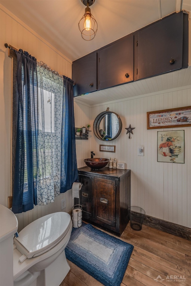 4441 Deckerville Rd, Lupton, MI 48635 - bathroom with wood finished floors, vanity, and wood walls