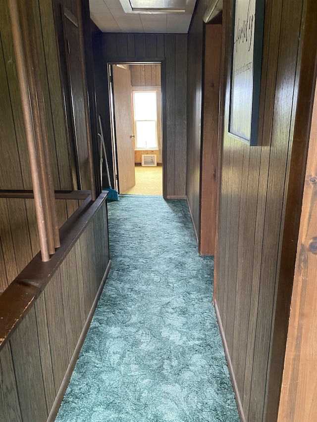4441 Deckerville Rd, Lupton, MI 48635 - hall with carpet, wooden walls, and attic access