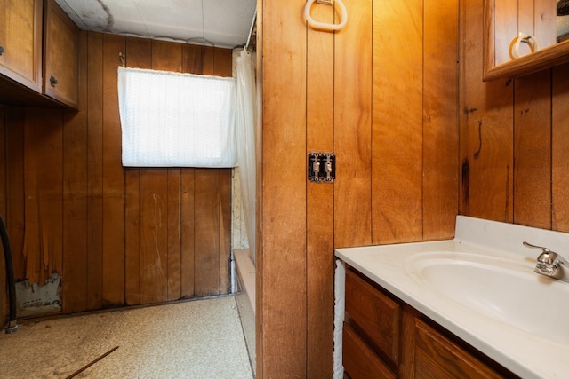 6038 SW Maple Hill Rd, Fife Lake, MI 49633 - full bathroom featuring vanity and wood walls