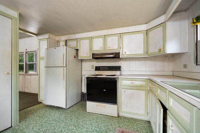 6038 SW Maple Hill Rd, Fife Lake, MI 49633 - kitchen featuring freestanding refrigerator, electric stove, under cabinet range hood, and light countertops