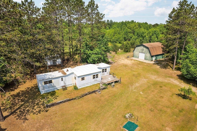 6038 SW Maple Hill Rd, Fife Lake, MI 49633 - aerial view of property and surrounding area featuring a heavily wooded area