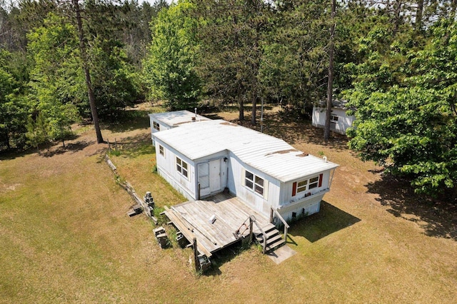 6038 SW Maple Hill Rd, Fife Lake, MI 49633 - view of subject property with a heavily wooded area
