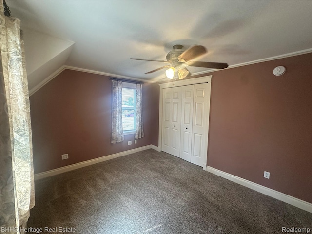 403 N Oak St, Durand, MI 48429 - unfurnished bedroom with carpet floors, a closet, a ceiling fan, ornamental molding, and lofted ceiling