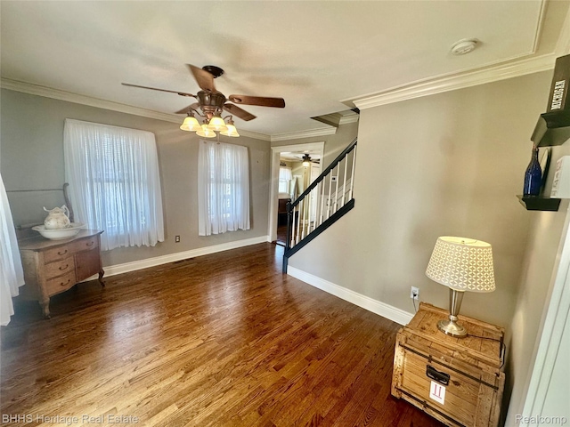 403 N Oak St, Durand, MI 48429 - living room with a ceiling fan, stairs, wood finished floors, and crown molding