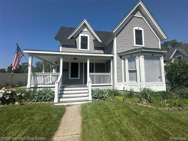 403 N Oak St, Durand, MI 48429 - view of front of house featuring covered porch and a shingled roof