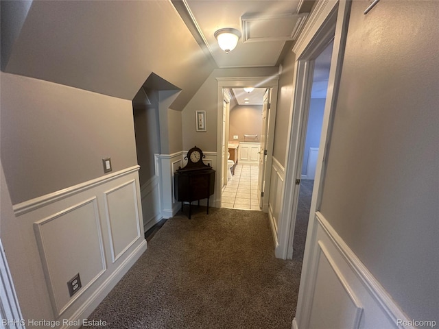 403 N Oak St, Durand, MI 48429 - hallway featuring carpet, lofted ceiling, wainscoting, and a decorative wall
