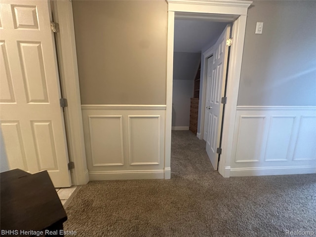 403 N Oak St, Durand, MI 48429 - hallway with a decorative wall, carpet flooring, and wainscoting